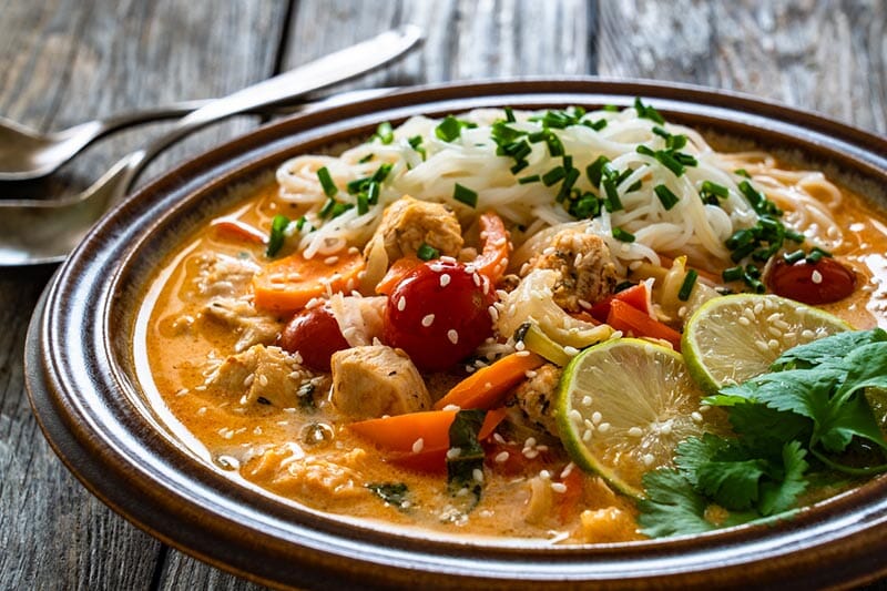 Tom Yum Chicken with Rice Noodles and Mad Dog 357 Pure Gold Mango Peach